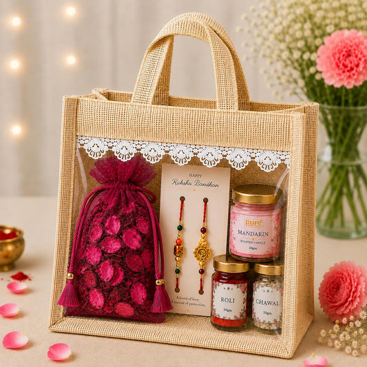 Pure Source India Raksha Bandhan Gift Hamper for Brother | Premium Jute Gift Bag with 2 Designer Rakhi, Mandarin Scented Candle, Pink Potpourri, Roli & Chawal