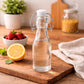 Premium 250ml Glass Water Bottle with Airtight Flip Top Cap | Leakproof & Reusable Bottle for Water, Juice, Oil, Vinegar