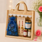 Pure Source India Raksha Bandhan Gift Hamper for Brother | Premium Jute Gift Bag with 2 Designer Rakhi, Mandarin Scented Candle, Pink Potpourri, Roli & Chawal