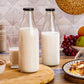 Milk, Water and Juice Glass Bottle With Airtight Black Cap - 1000 Ml (Transparent)
