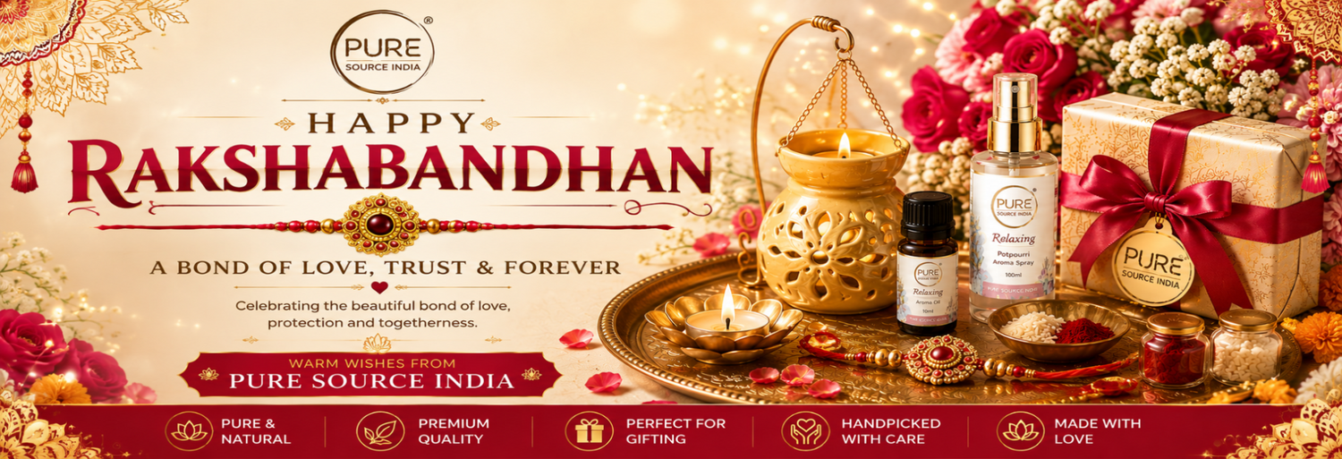 Rakshabandhan gift set from Pure Source India, featuring a golden decorative lamp, a small essential oil bottle, a skincare bottle, and a wrapped gift box on a decorative tray, surrounded by flowers and festive decorations.